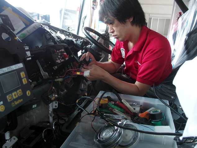 Teruhito Sugawara makes upgrades to the driver's seat.