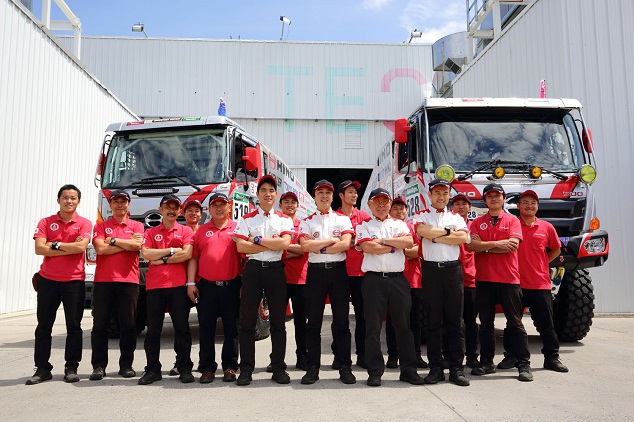 HINO TEAM SUGAWARA members are happy to have completed vehicle inspections without incident.