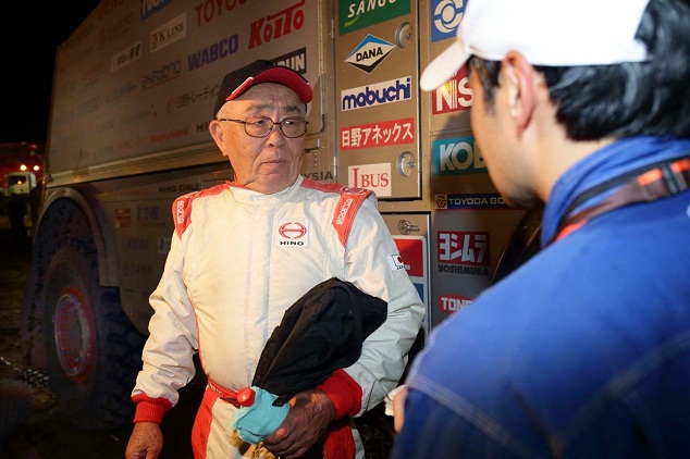 Yoshimasa Sugawara updates a mechanic on how the truck is doing.