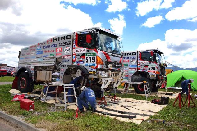 The team's two HINO500 Series trucks seen here being serviced at the bivouac in Salta.