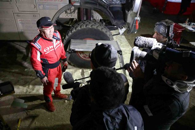 Yoshimasa Sugawara is interviewed after arriving at the bivouac.