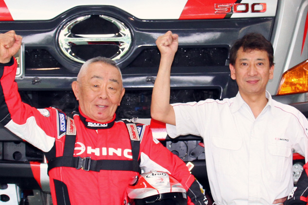 Yoshimasa Sugawara and Hideaki Takatori (right) pose in front of Car 1.