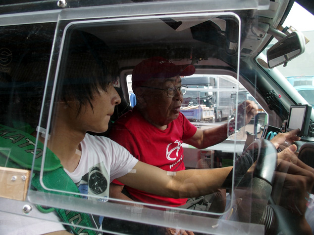 Yoshimasa Sugawara and Koji Tanaka (left) test their gear under simulated conditions.