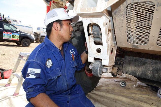 Mechanic Hironaga Hayashi inspects the front suspension.