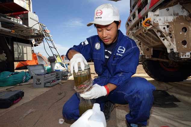 Mechanic Hiroya Fukuno cleans the fuel filter.