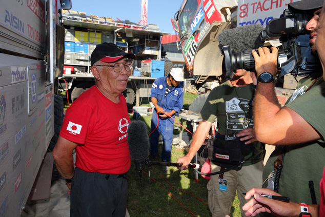 Yoshimasa Sugawara is interviewed by TV at the bivouac.