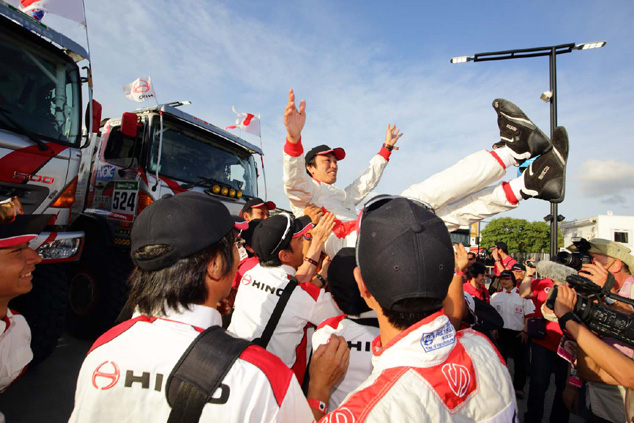 Teruhito Sugawara is thrown in the air in celebration.