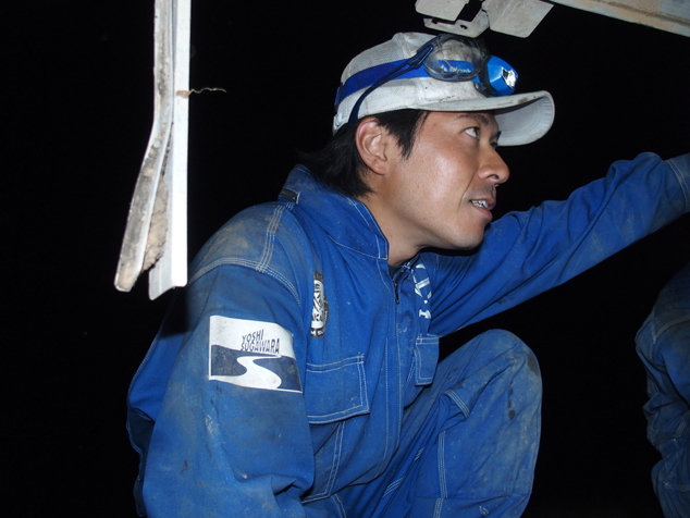 Well after sundown, sub-leader Masaki Nakamura (Hino Motors) is not done inspecting the truck.