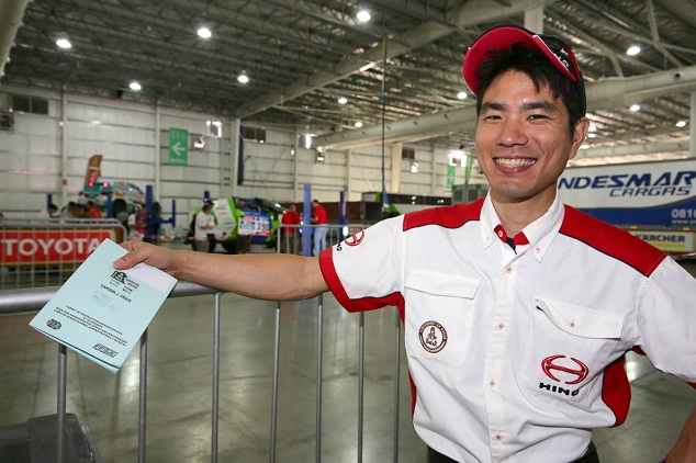 Hiroyuki Sugiura (navigator) is relieved at completing vehicle inspections.