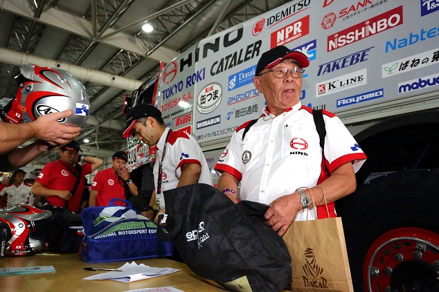 Yoshimasa Sugawara checks his truck's equipment.