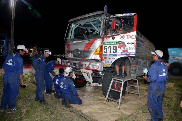 Mechanics check Car 2 after its arrival.