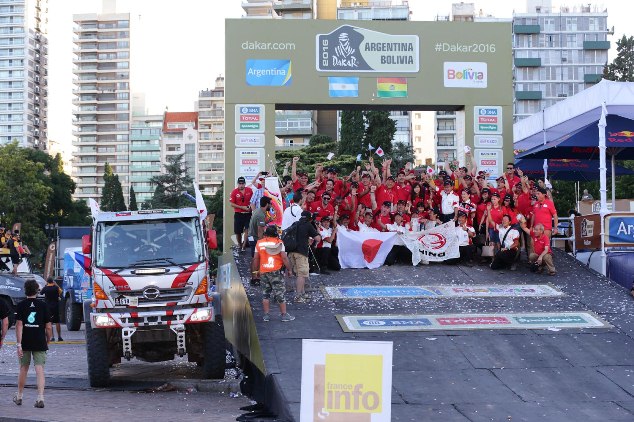 The Hino team celebrates on the podium.