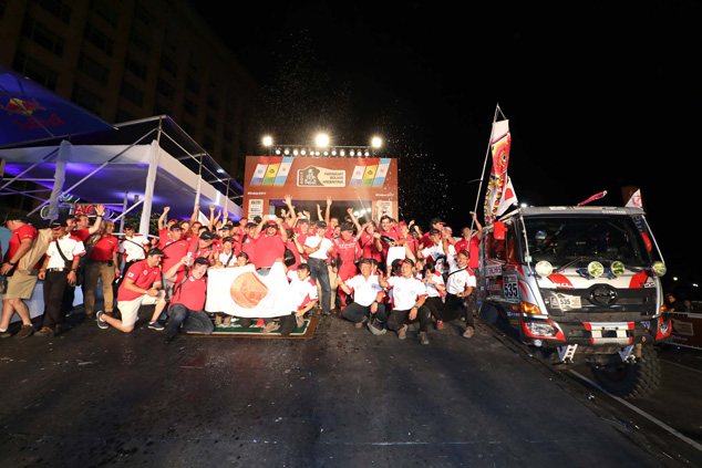 The Car 1 crew and staff members on the podium.